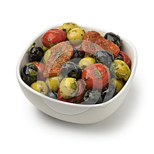 Bowl with green and black olives, peppers and tomatoes