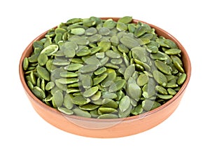 Bowl of green pepitas photo