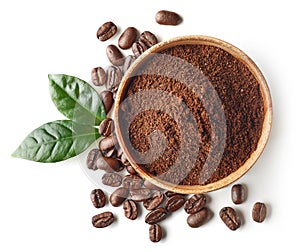 Bowl of ground coffee and beans isolated on white background