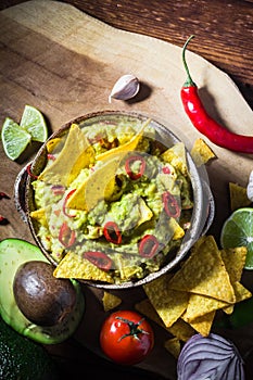 bowl guacamole chips ingredients tomato chilli pepper lime onion garlic dill
