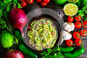 Bowl of Guacamole Surrounded by Fresh Ingredients