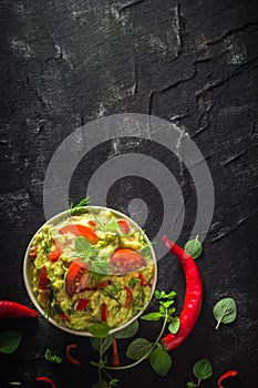 Bowl guacamole tomato chilli pepper lime onion garlic dill and oregano