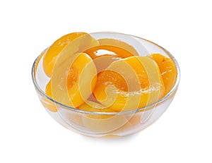 Bowl with halves of canned peaches