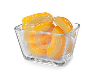 Bowl with halves of canned peaches