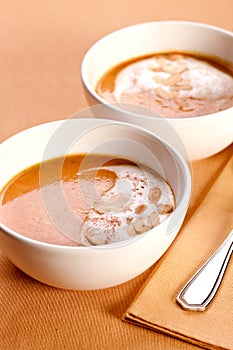 A bowl of healthy carrot lentil soup.