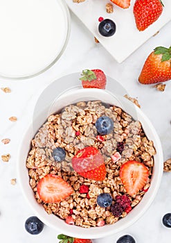 Bowl of healthy cereal granola with strawberries