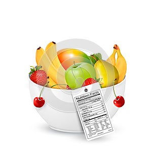 Bowl of healthy fruit with a nutrient label. photo