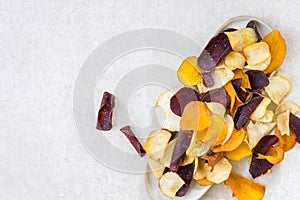 Bowl of Healthy Snack from Vegetable Chips, such as Sweet Potato