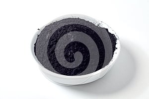 Bowl heaped with organic activated plant charcoal