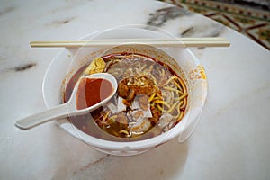 A bowl of Hokkien mee, which is a Chinese noodle dish popular in Penang, Malaysia