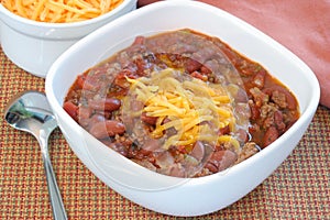 Bowl of Homemade Chili with Shredded Cheddar
