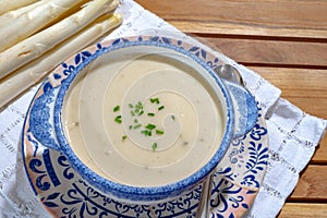 Bowl of homemade cream soup from white asparagus, spring season, new harvest of Dutch, German white asparagus, cooking with