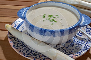 Bowl of homemade cream soup from white asparagus, spring season, new harvest of Dutch, German white asparagus, cooking with