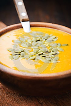 A bowl of homemade creamy pumpkin soup