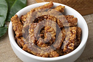 Bowl with homemade Indonesian sambal tempeh goreng close up photo