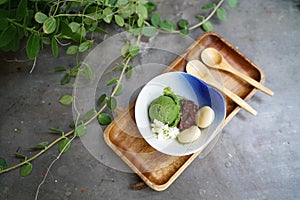 A bowl of homemade matcha ice cream green tea latte served wi