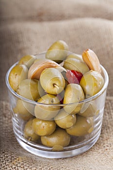 Bowl of homemade olives on a glass, typical spanish tapa