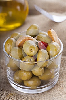 Bowl of homemade olives on a glass, typical spanish tapa