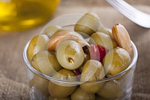 Bowl of homemade olives on a glass, typical spanish tapa