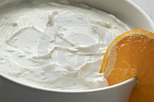 Bowl with homemade strained yoghurt close up