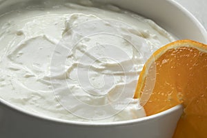 Bowl with homemade strained yoghurt close up photo