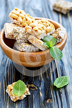 Bowl of honey bars with peanuts, sesame seeds and sunflower seed