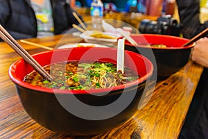 Bowl of hot and spicy chinese noodle soup, spicy ramen