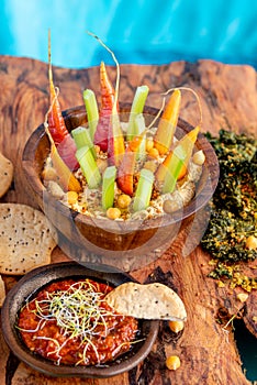 Bowl of humus with vegetables