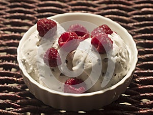 Bowl of ice cream with raspberries
