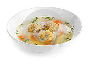 Bowl of Jewish matzoh balls soup on white