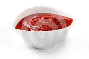 Bowl of ketchup or tomato sauce on white
