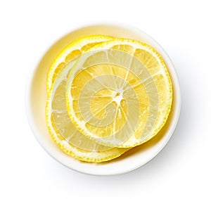 Bowl of lemon slices isolated on white, from above