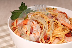 A bowl of linguine with shrimp photo