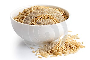 Bowl of long grain brown rice isolated on white.