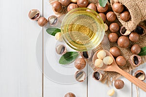 Bowl of macadamia nut oil and macadamia nuts