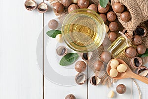 Bowl of macadamia nut oil and macadamia nuts