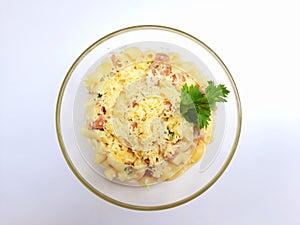 Bowl of macaroni cheese isolated on white background