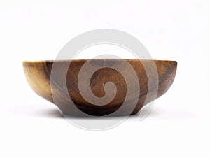 Bowl made of wood. Household kitchen utensils of walnut wood for dining