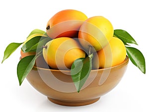 Bowl with mangoes and green leaves