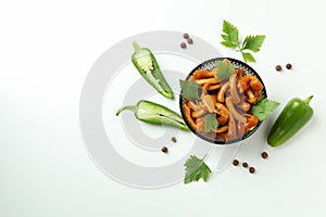 Bowl of marinated mushrooms on white background