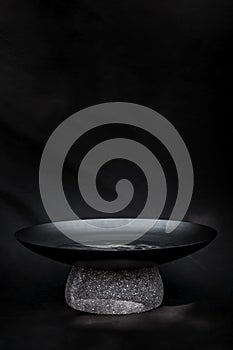 bowl with metal water and natural stone base, works as a water mirror, decoration, design photo