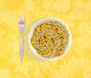 Bowl of Mexican rice on a floral table cloth