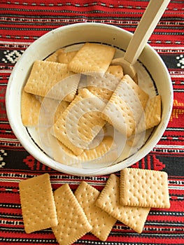 Bowl with milk and biscuits breakfast concept