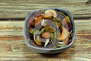 Bowl of mixed fruit and baked nut.