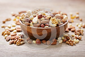 bowl of mixed nuts on wooden table