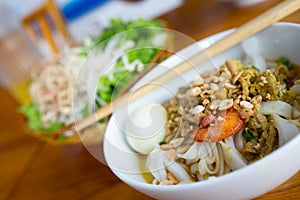 A bowl of Noodle with Pork, Shrimp, vegetables, and Egg (My Tom Thit Trung)