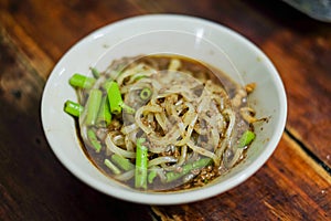 Bowl of noodle soup with morning glory & x28;Moo nam tok& x29; , Thailand.