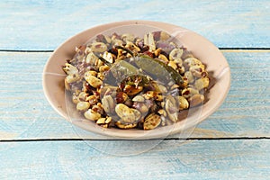 bowl of nuts, mixed with chopped onion and other ingredient