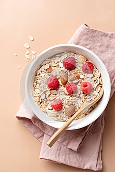 Bowl of oat muesli with raspberries