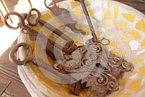 Bowl of old skeleton keys, rusted,